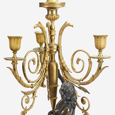 Lot 50 - A Pair of Louis XVI Style Gilt and Patinated Bronze Figural Four-Light Candelabra